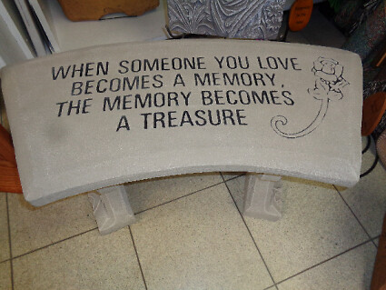 A TREASURE CEMENT GARDEN BENCH